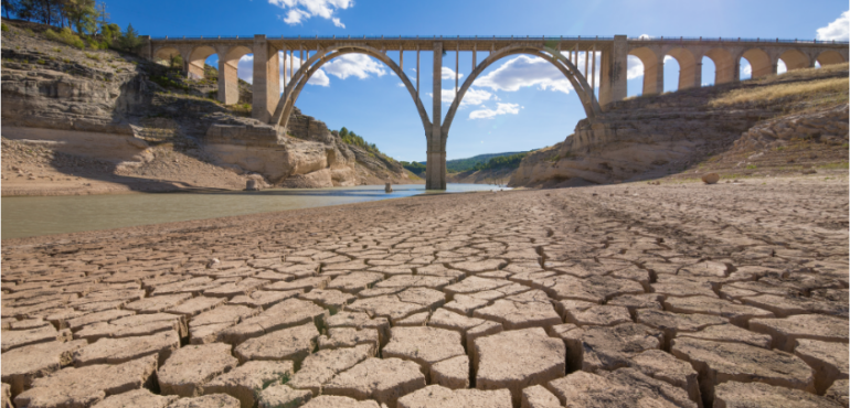landscape of dry earth ground and viaduct, extreme drought in Entrepenas reservoir, in Guadalajara, Castilla, Spain Europelandscape of dry earth ground and viaduct, extreme drought in Entrepenas reservoir, in Spain Europe